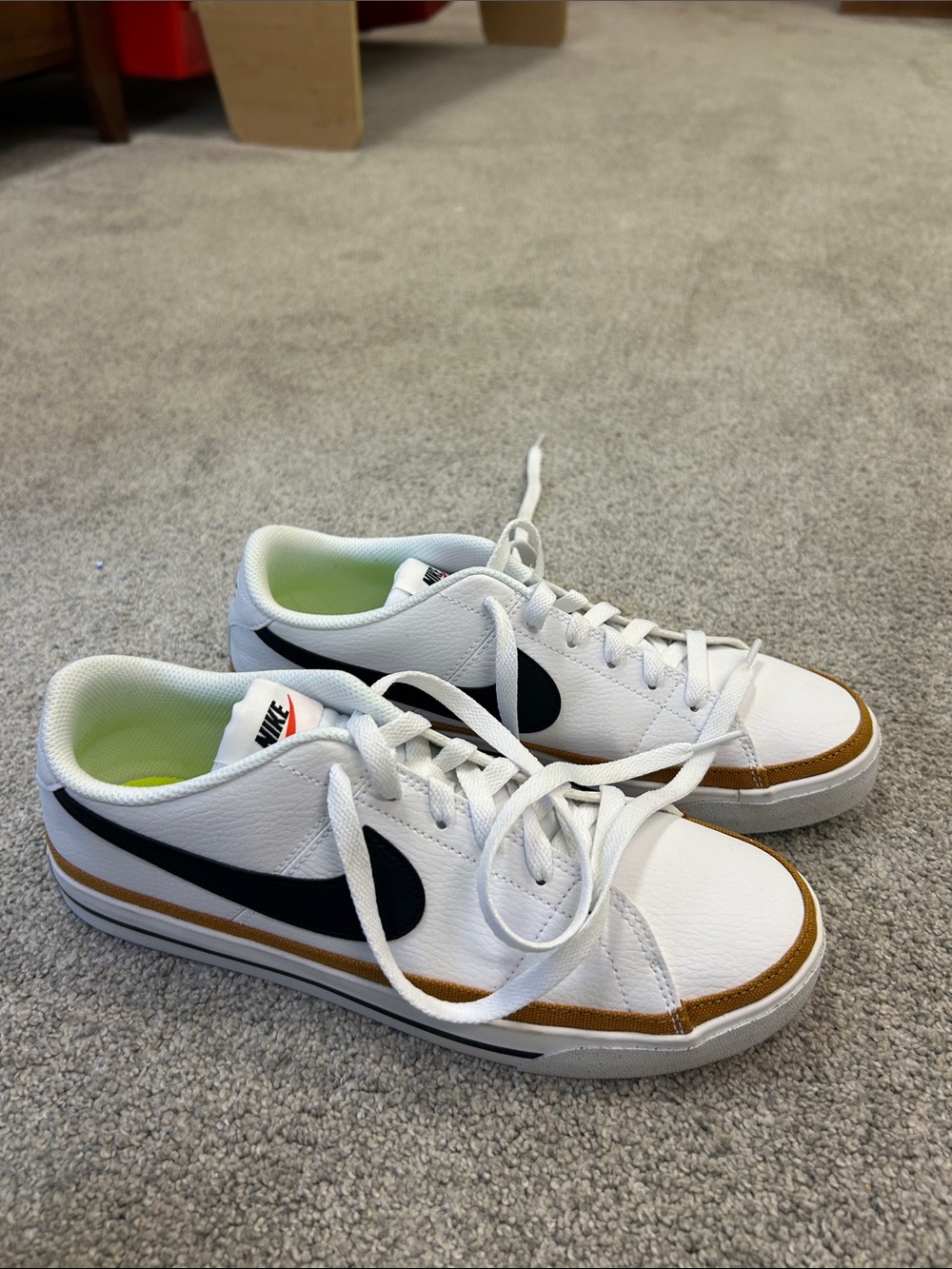 Nike Women’s White Sneakers with Black Swoosh and Brown Accent